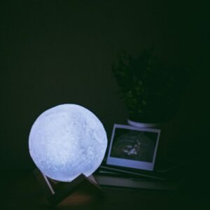 3D Moon Lamp glowing in the dark — realistic lunar surface