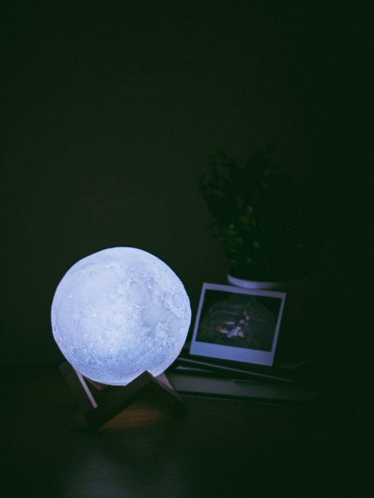 3D Moon Lamp glowing in the dark — realistic lunar surface