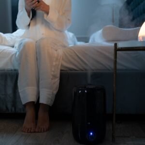 The Cloud rain cloud diffuser with mist and LED glow in bedroom — AuraHome